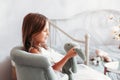 Little cute girl plays with a soft toy in a light children`s bedroom Royalty Free Stock Photo