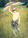 Little cute girl posing with a kite