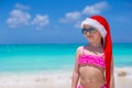 Little cute girl in red hat santa claus on the Royalty Free Stock Photo