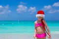 Little cute girl in red hat santa claus on the Royalty Free Stock Photo