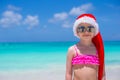 Little cute girl in red hat santa claus on the Royalty Free Stock Photo