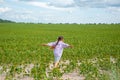 Little cute girl running across the soybean field, summer Royalty Free Stock Photo