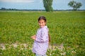 Little cute girl running across the soybean field, summer Royalty Free Stock Photo