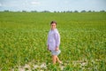 Little cute girl running across the soybean field, summer Royalty Free Stock Photo