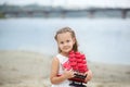 Little cute girl and scarlet sails. Close-up portrait of the girl`s face. little girl wait boat with scarlet sail. Summer day. Hap Royalty Free Stock Photo