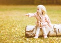 Little cute girl shows gesture hands toward