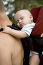 Little cute girl sleaping in sling.