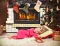 Little cute girl sleeping under the Christmas Tree waiting for S Royalty Free Stock Photo