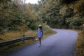 Little cute girl in a straw hat. Evening forest walk with an ancient lantern in his hands. Summer, sunlight, portrait Royalty Free Stock Photo