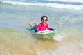Little cute girl swimming in Maracas Bay Beach Trinidad
