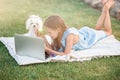 Little girl outdoors in the park with computer Royalty Free Stock Photo