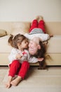 Little cute girls on the couch upside down Royalty Free Stock Photo