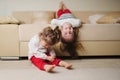 Little cute girls on the couch upside down Royalty Free Stock Photo