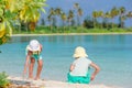 Little adorable girls drawing picture on white beach Royalty Free Stock Photo