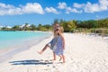 Little cute girls walking along the white beach Royalty Free Stock Photo