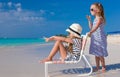 Little cute girls on white beach during vacation Royalty Free Stock Photo