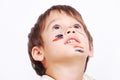 Little cute kid with colors on his face Royalty Free Stock Photo