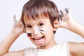 Little cute kid with colors on his face Royalty Free Stock Photo