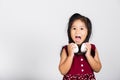 Little cute kid girl 3-4 years old listen music in wireless headphones Royalty Free Stock Photo