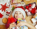 Little cute kid in santas red hat with handmade Royalty Free Stock Photo