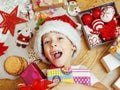 Little cute kid in santas red hat with handmade Royalty Free Stock Photo