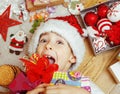 Little cute kid in santas red hat with handmade Royalty Free Stock Photo