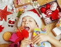 Little cute kid in santas red hat with handmade Royalty Free Stock Photo