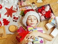 Little cute kid in santas red hat with handmade Royalty Free Stock Photo