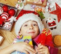 Little cute kid in santas red hat with handmade Royalty Free Stock Photo