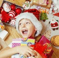Little cute kid in santas red hat with handmade Royalty Free Stock Photo