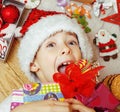 Little cute kid in santas red hat with handmade Royalty Free Stock Photo