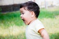 Little latin boy shouting outdoors. Royalty Free Stock Photo