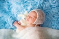 Little cute newborn baby boy, sleeping wrapped in white wrap Royalty Free Stock Photo