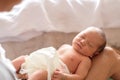 Little cute newborn girl wearing a diaper sleeping on mother lap Royalty Free Stock Photo