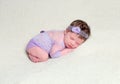 Infant baby girl in lace violet outfit