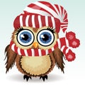 A little cute owl in a red and white hat with a pompon, a winter owl, shelter from the cold Royalty Free Stock Photo