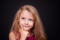 Little cute pensive girl in a bright pink dress Royalty Free Stock Photo