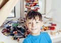 Little cute preschooler boy playing lego toys at home happy smiling, lifestyle children concept Royalty Free Stock Photo