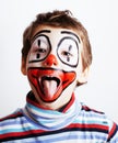 Little cute real boy with facepaint like clown, pantomimic expre
