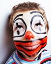 little cute real boy with facepaint like clown, pantomimic expre