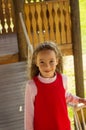 Little cute school girl portrait having fun and playing outdoor in summer day