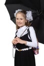 Little cute schoolgirl posing on a white background