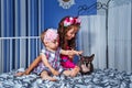 Little cute sisters and sphinx cat Royalty Free Stock Photo