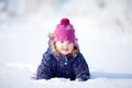 Little cute toddler girl outdoors on a sunny winter day. Royalty Free Stock Photo