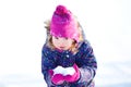 Little cute toddler girl outdoors on a sunny winter day. Royalty Free Stock Photo