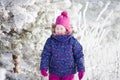 Little cute toddler girl outdoors on a sunny winter day Royalty Free Stock Photo