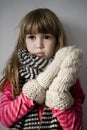 Little cute upset girl with scarf