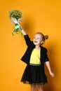 Little cute 5-year-old girl holds a large bouquet of daisies Royalty Free Stock Photo