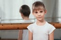 Dancer standing near barre