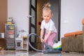 little daughter cleaning in the house, child dusting, Cute little helper girl washing floor with mop, happy family Royalty Free Stock Photo